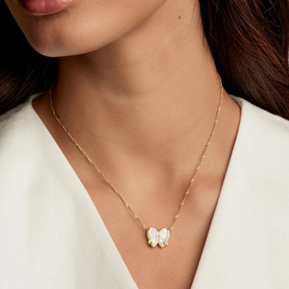 YEEVAA Bow Short Pendant Necklace in Carved Mother-of-Pearl