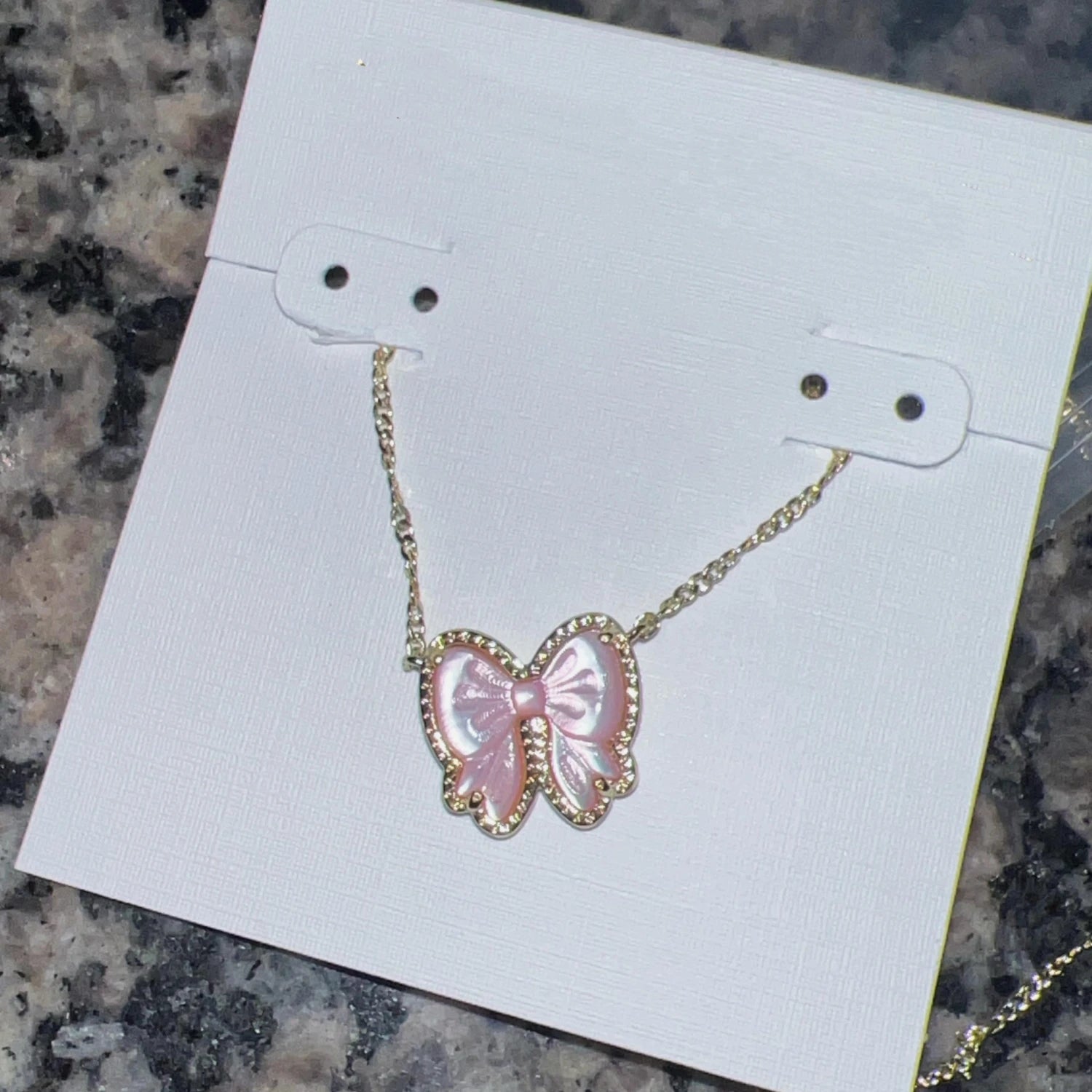 YEEVAA Bow Short Pendant Necklace in Carved Mother-of-Pearl