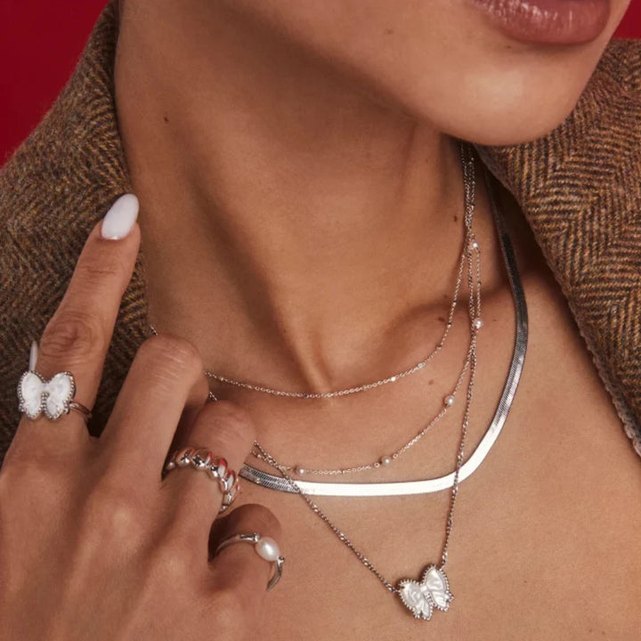 YEEVAA Bow Short Pendant Necklace in Carved Mother-of-Pearl